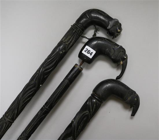 Three Ceylonese ebony walking sticks